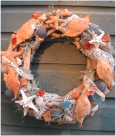 Beautiful driftwood wreath with shells and lace. Learn how to make your own at www.shellcrafter.com