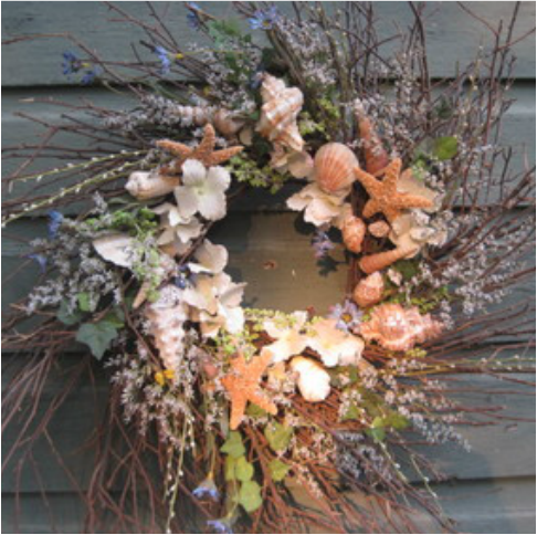 Rustic twig wreath with shells and flowers. Learn how to make this at www.shellcrafter.com